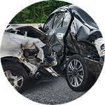 Two damaged cars at the scene of a collision.